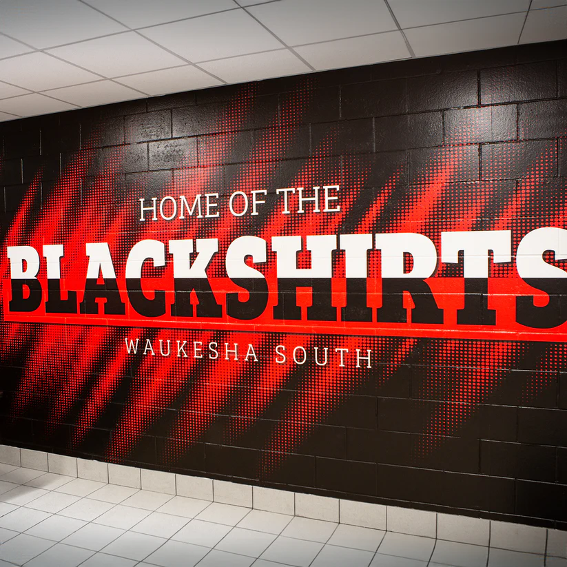 Black and red Blackshirts wall mural installed inside a school